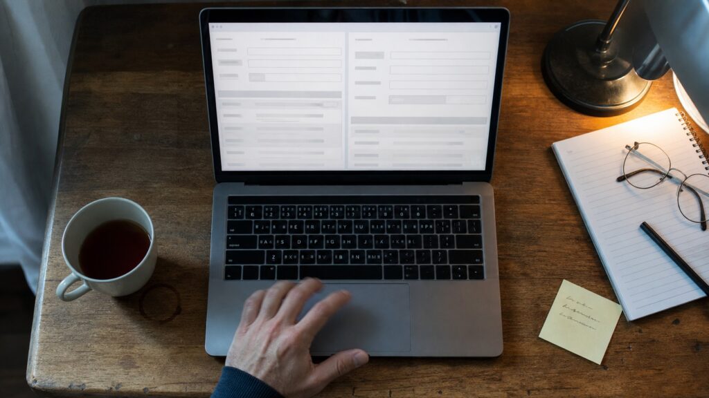 close-up of a WHOIS lookup and ABN search open on a laptop to check au domain rules compliance