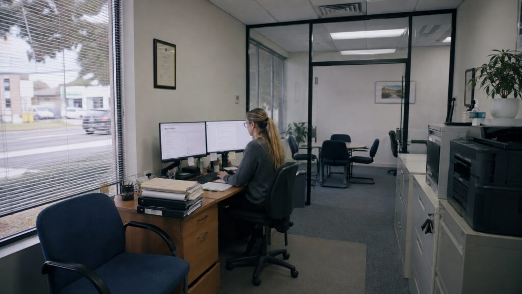 Small Australian law firm office where staff use AI legal software for intake